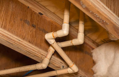 Tracing hidden plumbing water leaks behind interior drywall